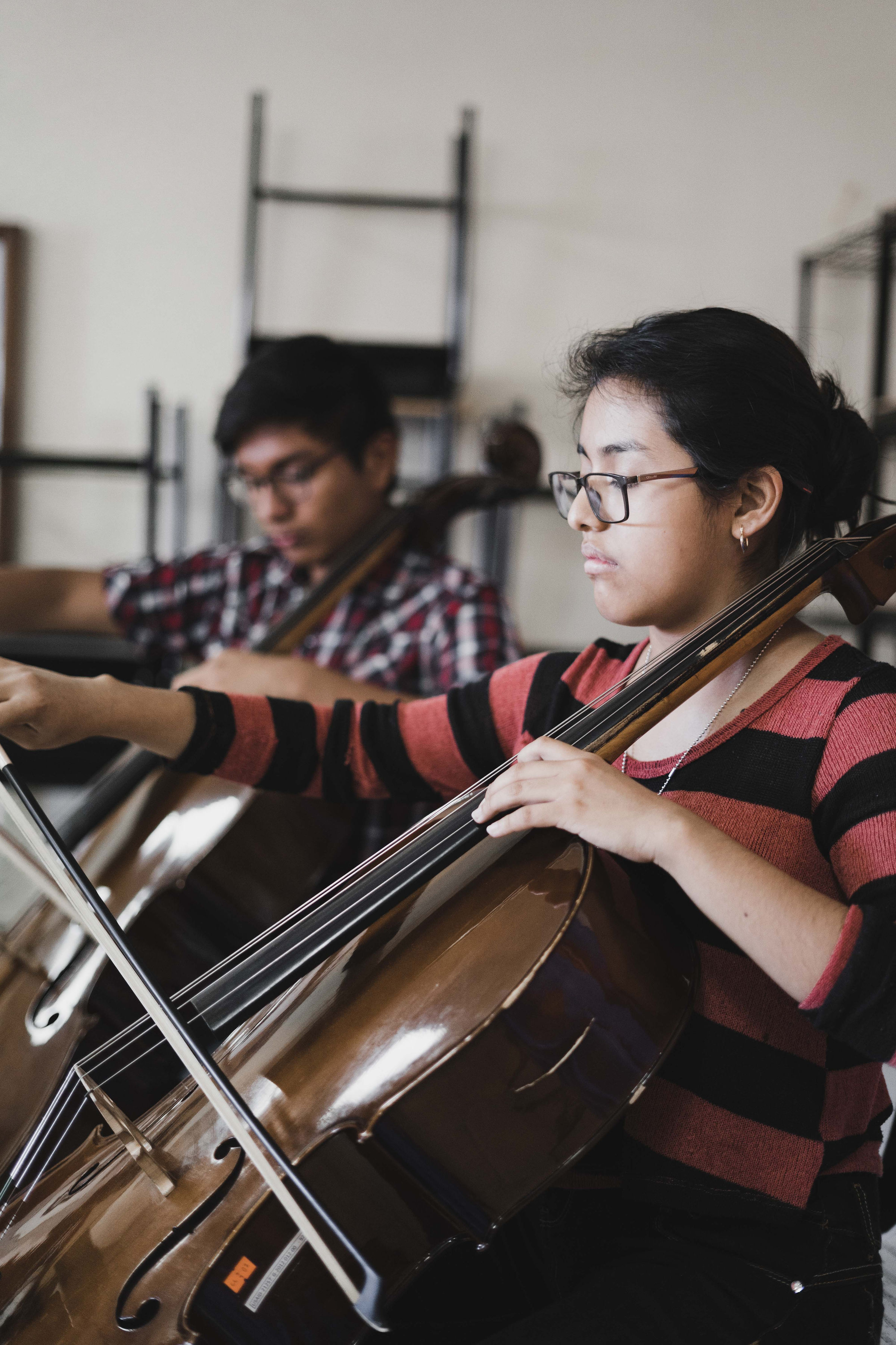 Cellists playing together