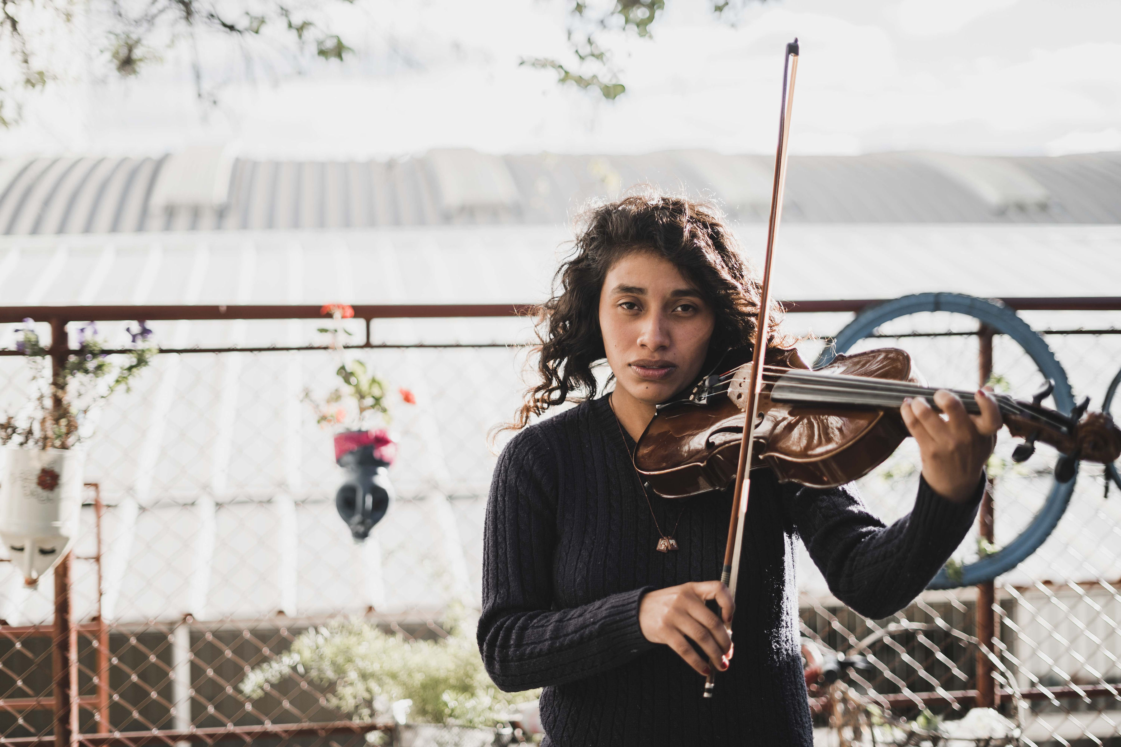 A violinist playing with focus
