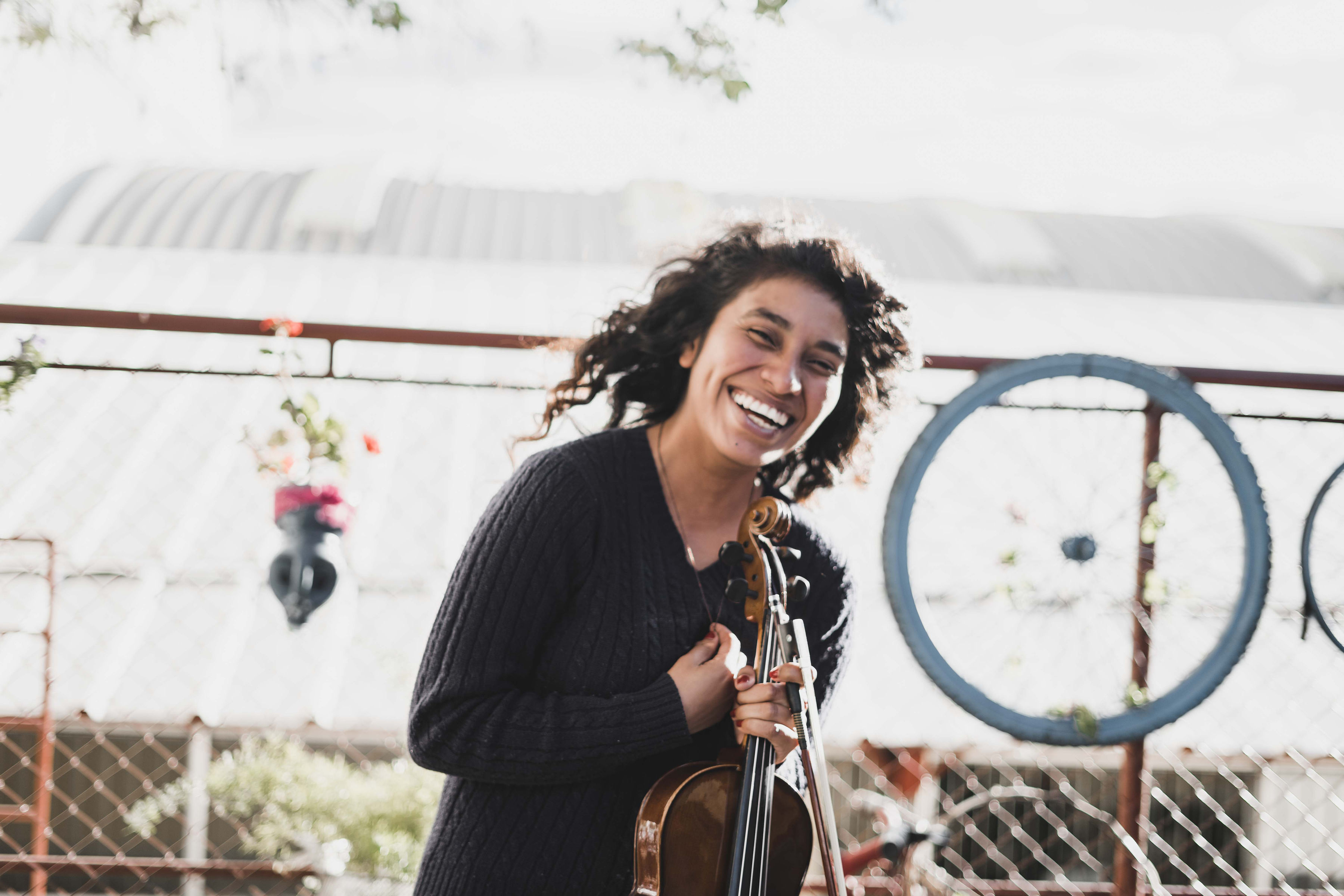 A violinist laughing